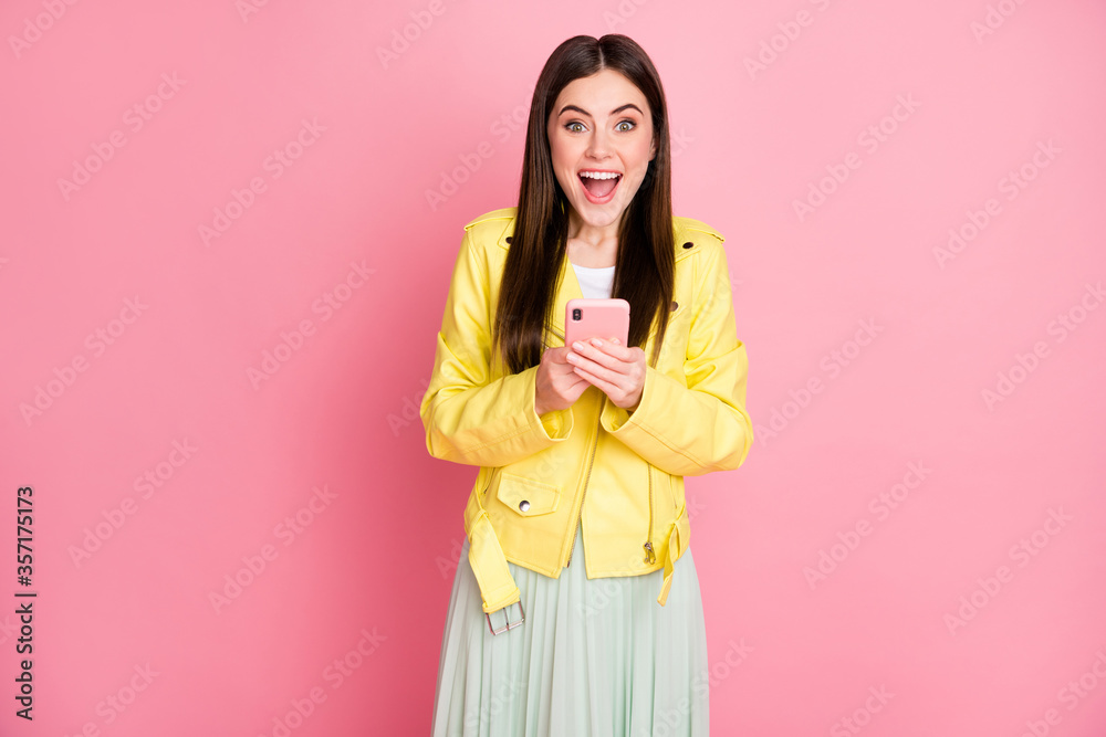 Portrait of her she nice-looking attractive lovely glad cheerful cheery girl using cell good luck browsing app 5g isolated on bright vivid shine vibrant yellow color background Portrait of her she nice-looking attractive lovely glad cheerful cheery girl using cell good luck browsing app 5g isolated on bright vivid shine vibrant yellow color background