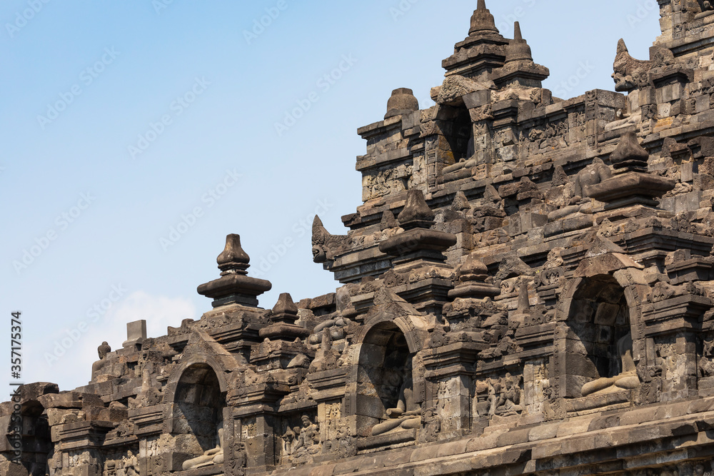 View of the rows of balustrades and niches, decorated with their respective stupas and reliefs, in the eastern part of the Borobudur temple, Central Java, Indonesia.