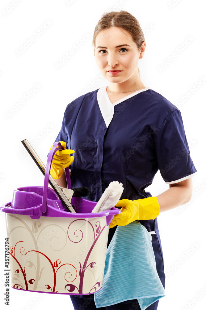 Young woman holding cleaning tools and products in bucket, isolated on white Young woman holding cleaning tools and products in bucket, isolated on white
