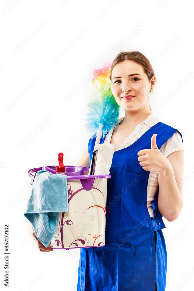 Woman finished cleaning showing a happy thumbs up after a successful spring cleaning. Beautiful model isolated on white background. Woman finished cleaning showing a happy thumbs up after a successful spring cleaning. Beautiful model isolated on white background.