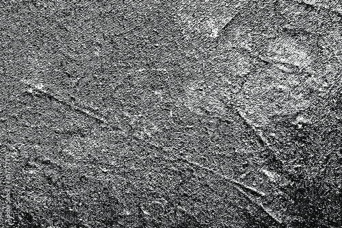 Dark grunge texture of the old damaged surface of the leatherette. Monochrome halftone background of an uneven dermatin with spots, creases, noise and grain. Overlay template. Vector illustration photo
