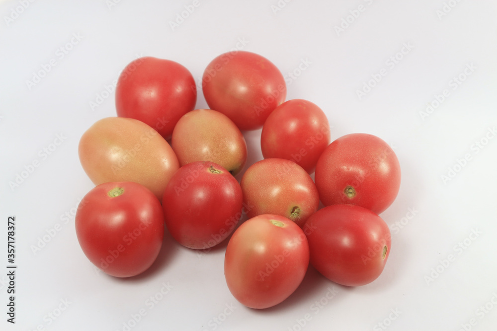 Delicious red tomatoes on white background Delicious red tomatoes on white background
