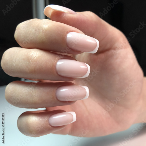 French manicure on the nails. French manicure design. Manicure gel nail polish