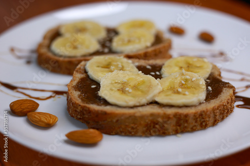 healthy dessert with chocolate paste and bananas