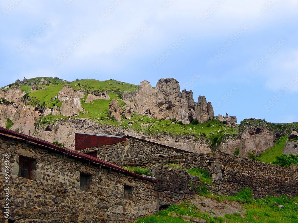 Eastern outskirt of Goris, Armenia, and beginning of so called Stone Forest, reserve of pyramid-like geological formations and ancient caves. All these rocks are part of Zangezur Mountains