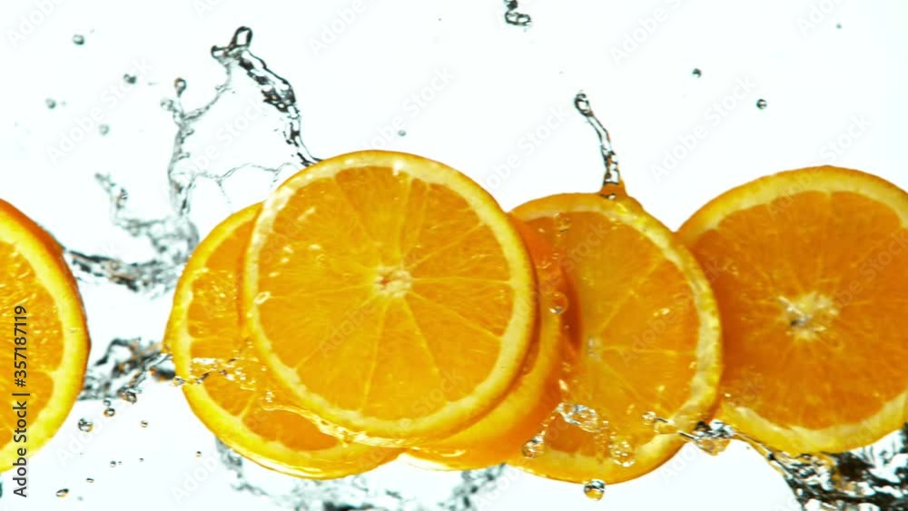 Fresh Fruit Slices Falling with Water Splash in Super Slow Motion. Shot at 1000 fps Fresh Fruit Slices Falling with Water Splash in Super Slow Motion. Shot at 1000 fps