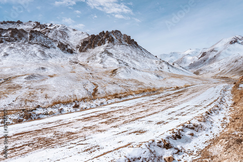 the gravel road on the snow mountain