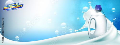 Laundry detergent banner. Blank bottle filled by detergent with liquid soap splash and bubbles on bright blue background ready for branding and ads design.