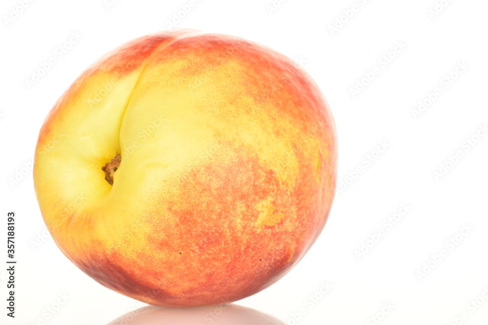 Ripe juicy organic nectarine, macro, on a white background. Ripe juicy organic nectarine, macro, on a white background.