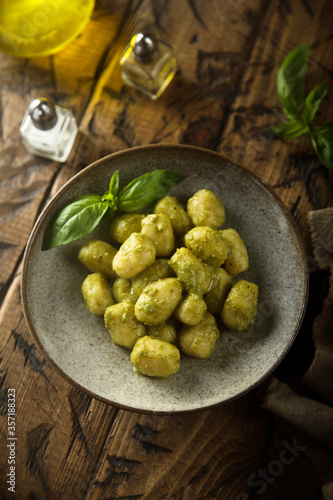 Homemade potato gnocchi with pesto sauce
