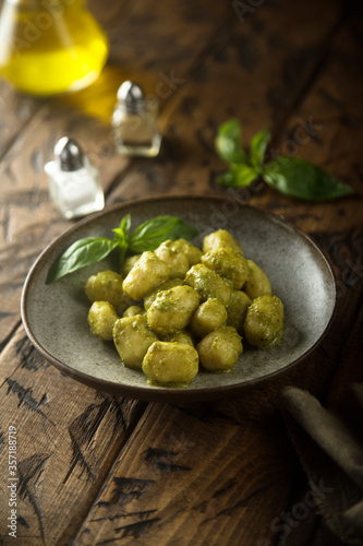 Homemade potato gnocchi with pesto sauce