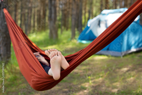 young woman relaxing in hammock