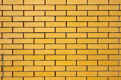 yellow bricks in masonry wall