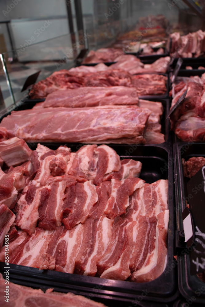 Showcase of a butcher's shop. Close-up. Pork.  Fresh.