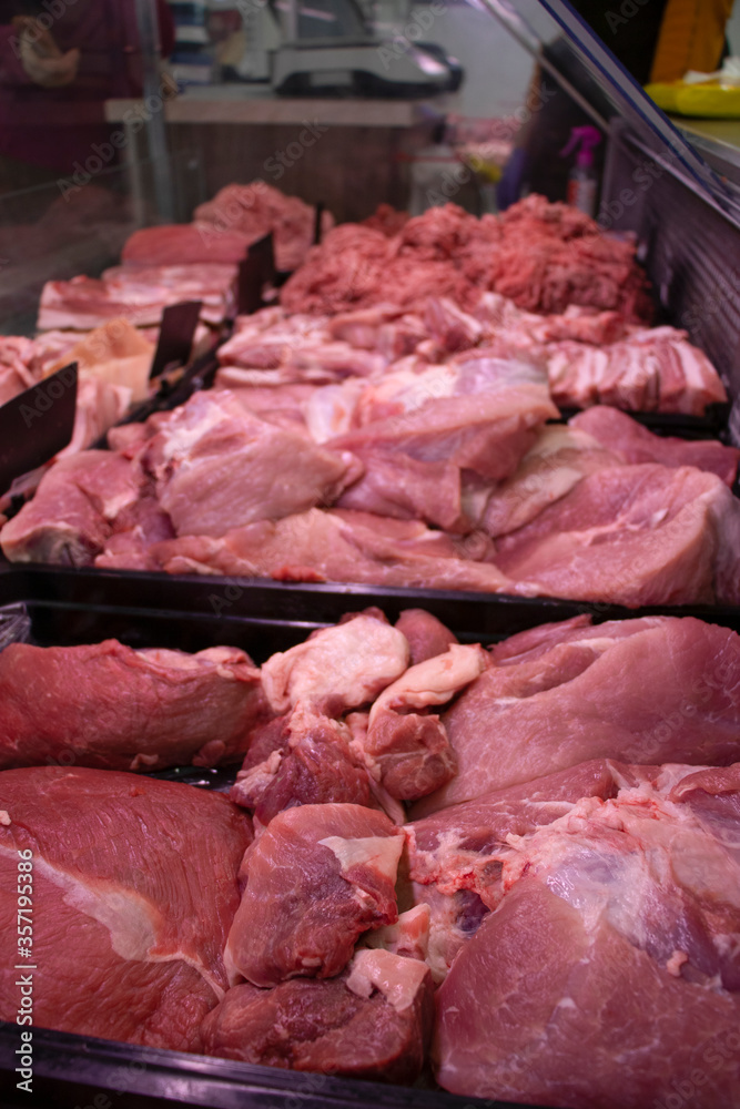 Showcase of a butcher's shop. Close-up. Pork.  Fresh.