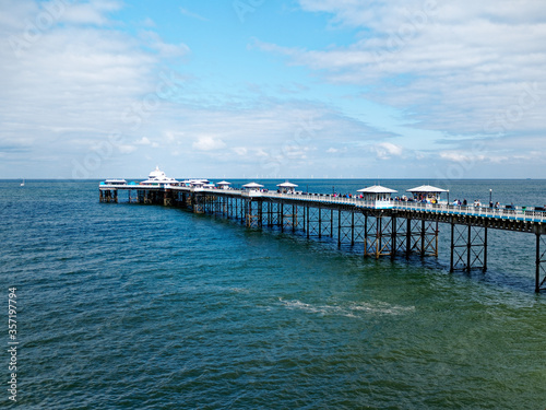 Llandudno pier stretching out into the sea as seen from the Great Orme, in North Wales, United Kingdom.