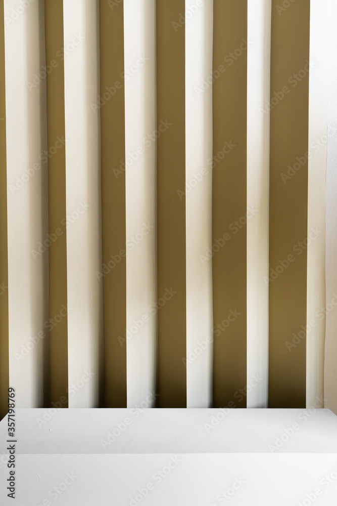 Studio table top with corrugated wall with yellow color paint in minimal style interior/ copy space / empty scene Studio table top with corrugated wall with yellow color paint in minimal style interior/ copy space / empty scene