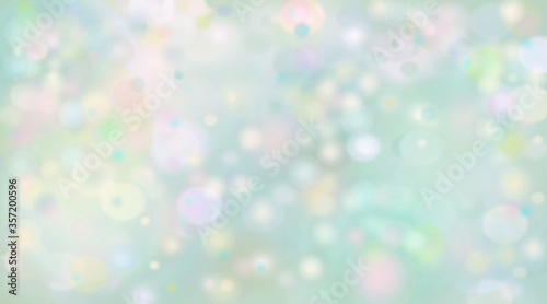 illustration of a light green and pink blurred background with bokeh