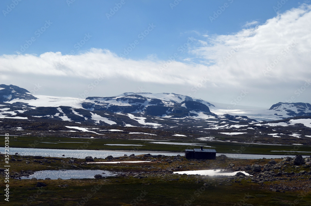 Views from the train window. Mountain tundra of Central Norway. Railway travel in Norway.The Bergen - Oslo train.
