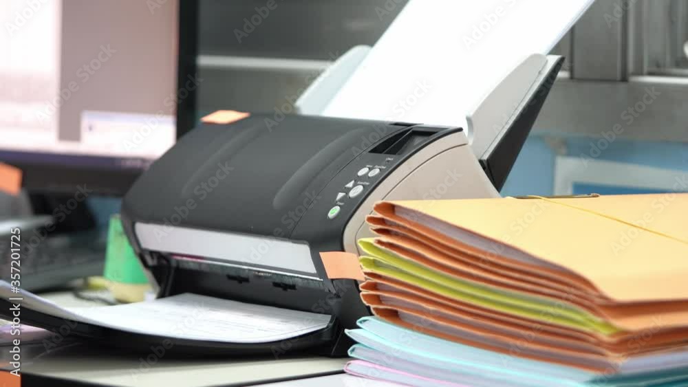 Using scanner machine for convert document to digital data storing into computer in office, to reduce usage and reuse paper. Using scanner machine for convert document to digital data storing into computer in office, to reduce usage and reuse paper.