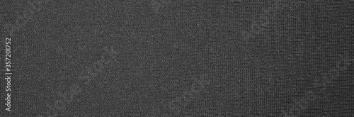 Texture of dense black fabric.Dark grey braided background. © begun1983