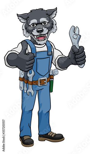 A wolf cartoon animal mascot plumber, mechanic or handyman builder construction maintenance contractor holding a spanner or wrench and giving a thumbs up