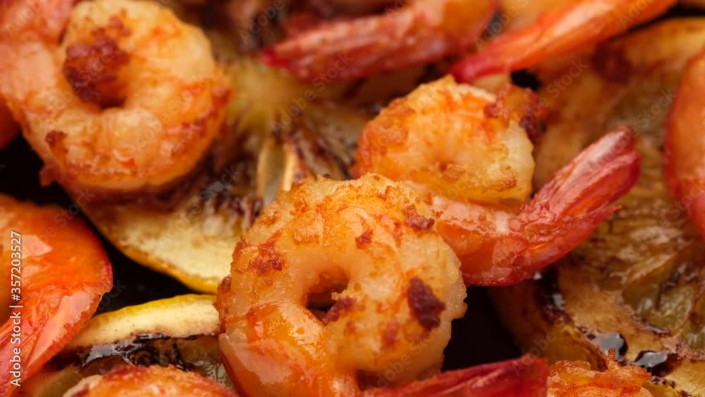 fried shrimps with lemon top view rotating. closeup fried shrimps with lemon top view rotating. closeup