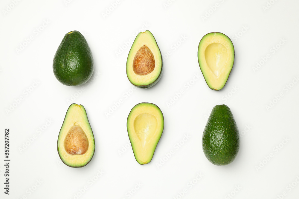 Flat lay with avocado on white background, top view Flat lay with avocado on white background, top view