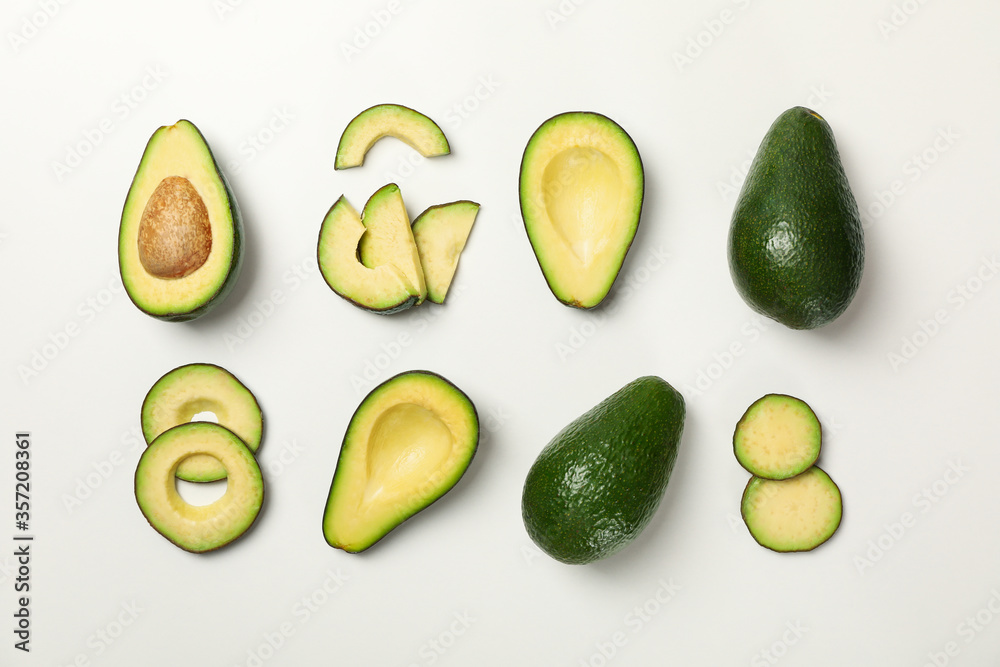 Flat lay with avocado on white background, top view Flat lay with avocado on white background, top view