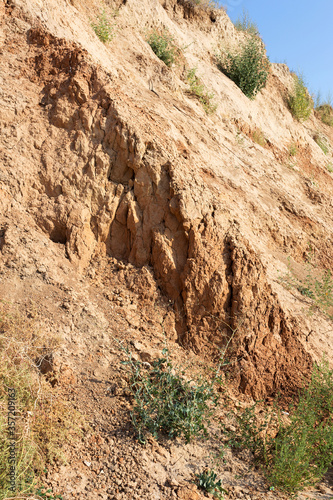 The collapse of wet sandy soil on the coast