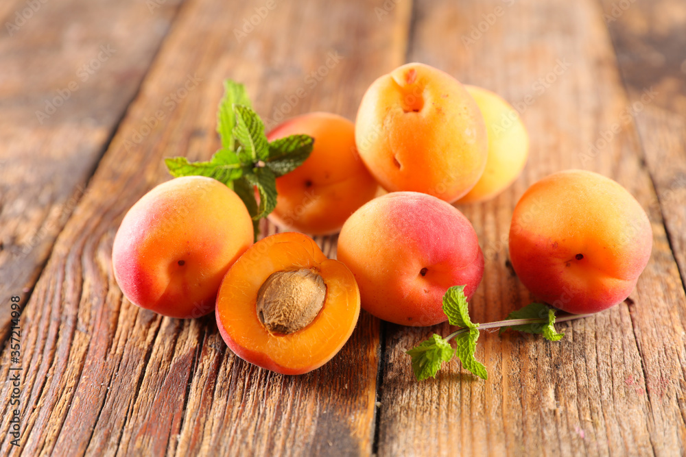 fresh apricot on wood background