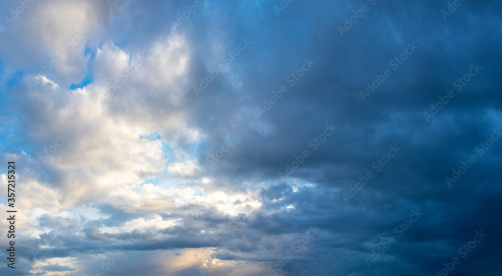 Sky with white and dark dramatic storm clouds