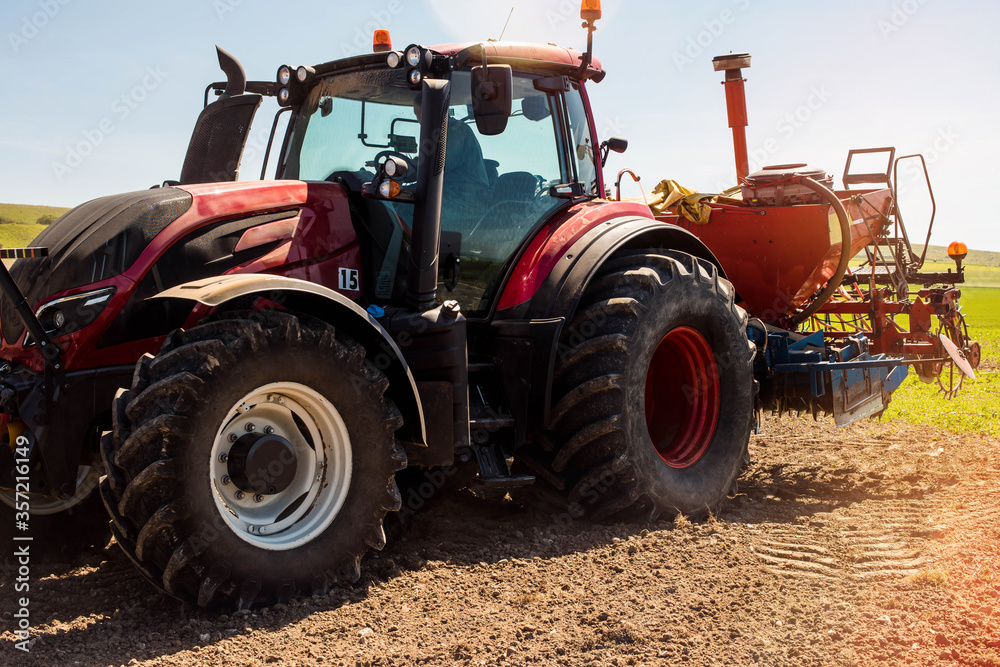 farmer in his tractor sowing in the fields farmer in his tractor sowing in the fields