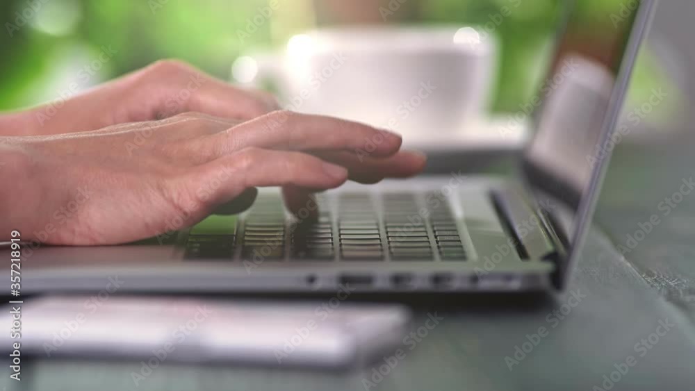 Female hands typing on laptop, pressing its buttons. Working from home, coding software and communicating online. 4K Female hands typing on laptop, pressing its buttons. Working from home, coding software and communicating online. 4K