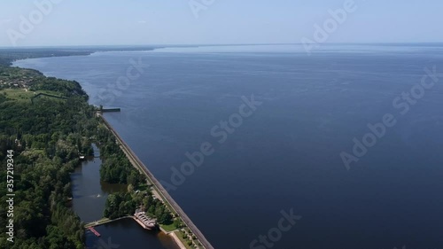 Aerial view. A large exotic wooden ship is located near the shore. Green lagoon. Kiev, Mezhyhirya. Drone