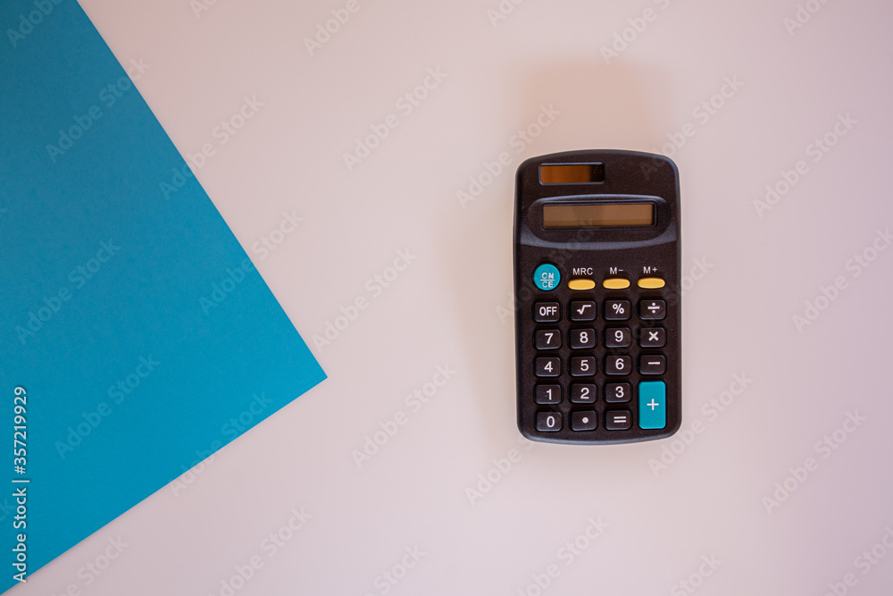 Calculator on white and blue background. Calculator on white and blue background.
