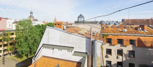 Panorama view of red roofs in old town of Riga, Latvia. Sunny summer day.