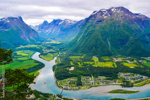 Scenic landscape Andalsnes city located on shores of Romsdal Fjord between the picturesque mountains. View from Rampestreken Viewpoint, Andalsnes, Norway. photo