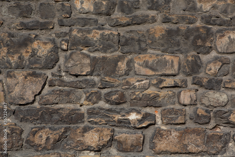 Brick stone wall. Masonry or brickwork of antique construct. Texture or background.