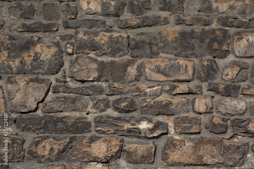 Brick stone wall. Masonry or brickwork of antique construct. Texture or background.