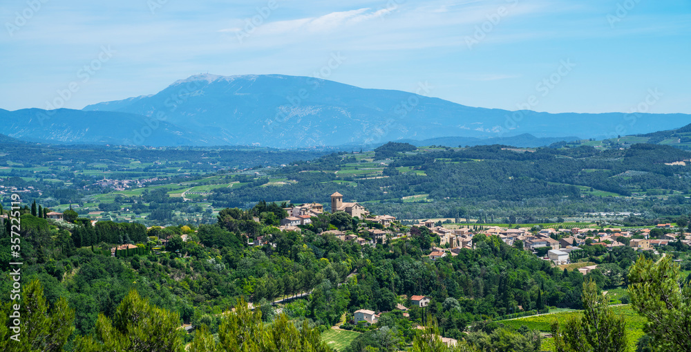 Great view of the medievel village, vineyards and countryside landscape in Gordes, Vaucluse, Provence, France, Europe. Famous Cotes du Rhone Tourist Route. Picturesque scene. Beauty world.