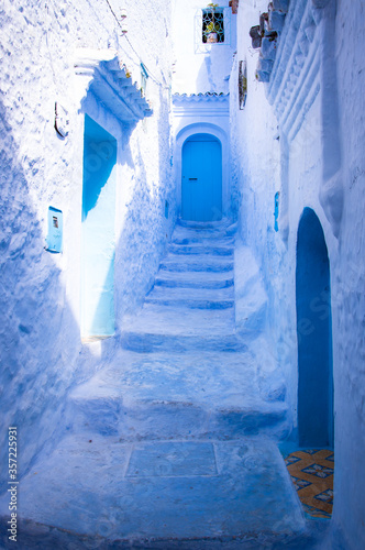 colorful blue street in the Moroccan city of Chaouen © Daniel Carpio