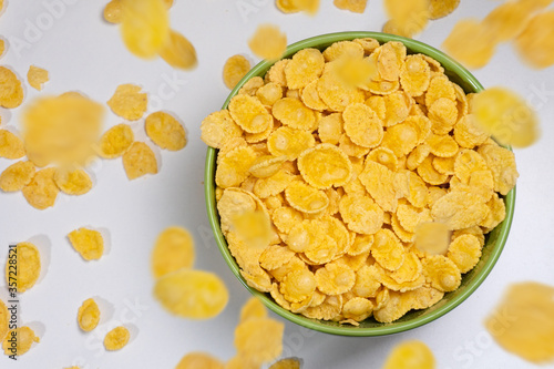 Bowl of corn flakes isolated on white background