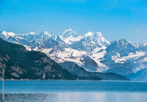 Beautiful coast view of Alaska with snowy mountains in the Summer  © Jay