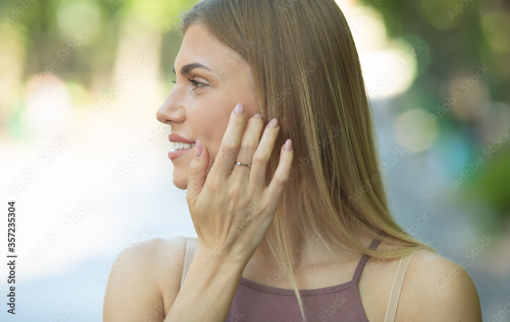 Portrait of young happy smiling woman outdoor on street. Portrait of young happy smiling woman outdoor on street.