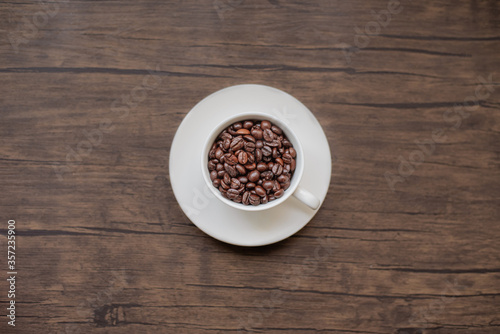 roasted coffee beans, blure background and mug