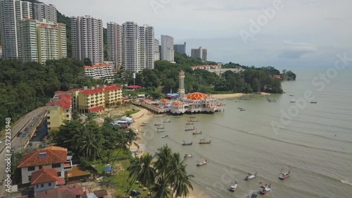 Mosque Tengku Tengah Zaharah or also known as Floating Mosque in Kuala Terengganu, Malaysia with reflection. (aerial photography) photo