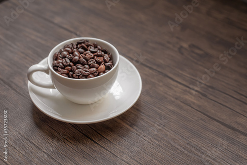 roasted coffee beans, blure background and mug