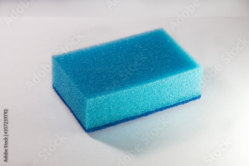 Sponge. Blue sponge. Side view. Sponge on a white background.