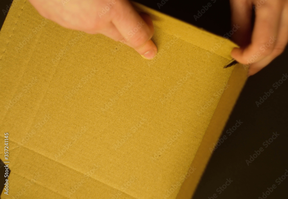 Top view hands making box. Step by step. Packing box Top view hands making box. Step by step. Packing box